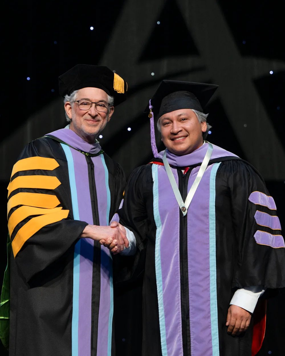 Dr. Thomas Goulding on stage at the Academy of General Dentistry 2026 convocation