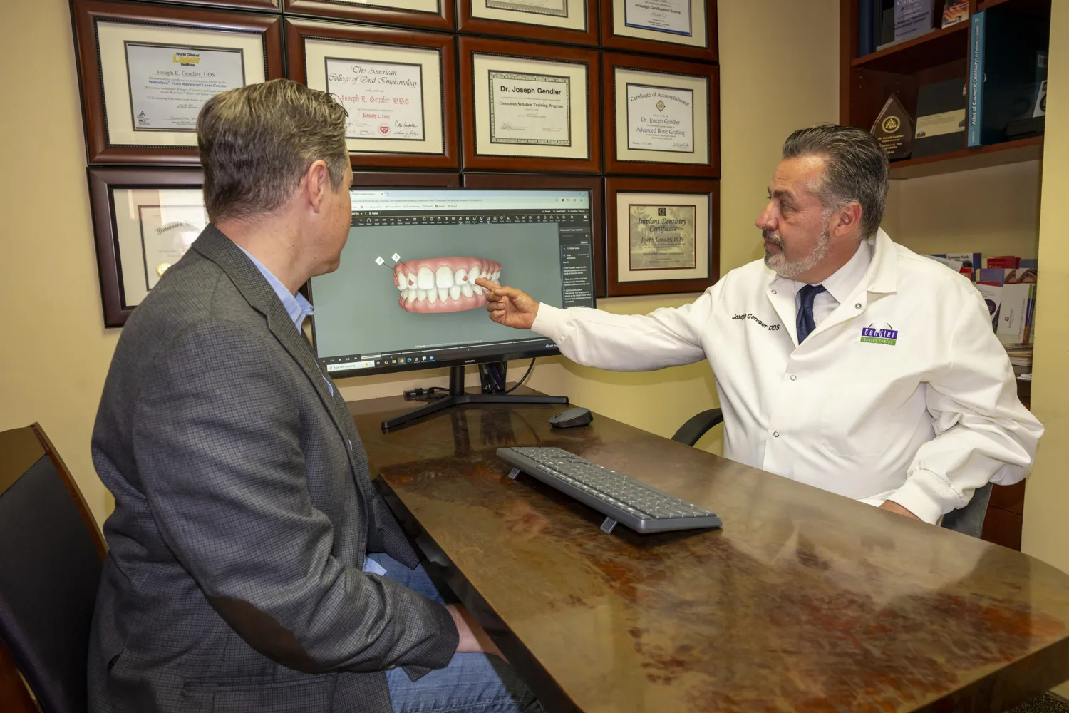 Dr. Gendler reviewing a clear-aligner case with an adult patient
