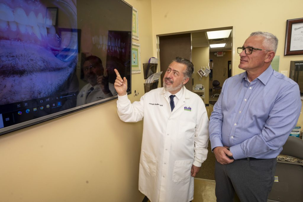Dental patients work with design technology to preview smiles before dental treatment.