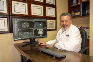 Dr. Gendler matching dental implant results to a digital smile design.